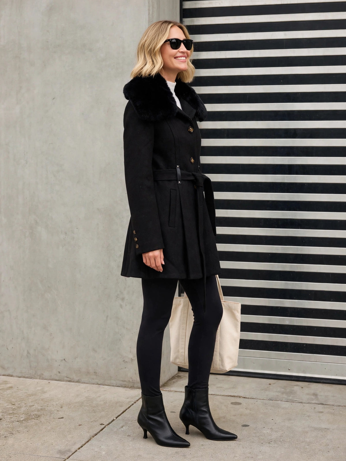 The Audrey Coat, black faux fur coat, side view